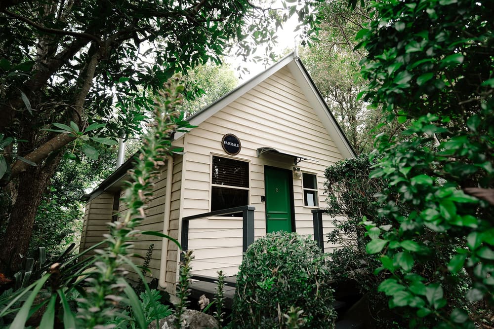 One of the private cottages among the trees at Shambala Estate